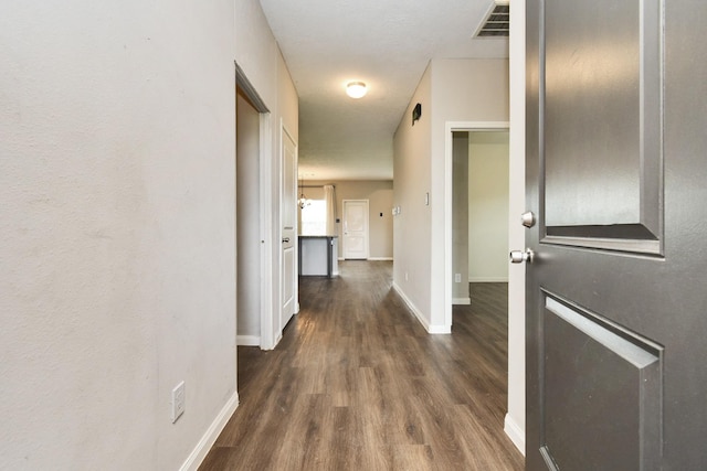 hall with dark hardwood / wood-style flooring