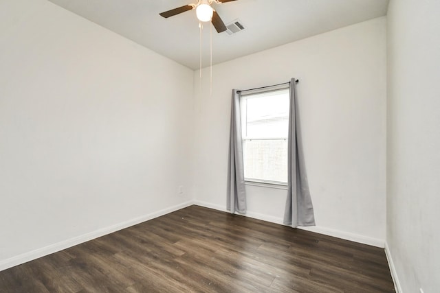 spare room featuring ceiling fan and dark hardwood / wood-style floors