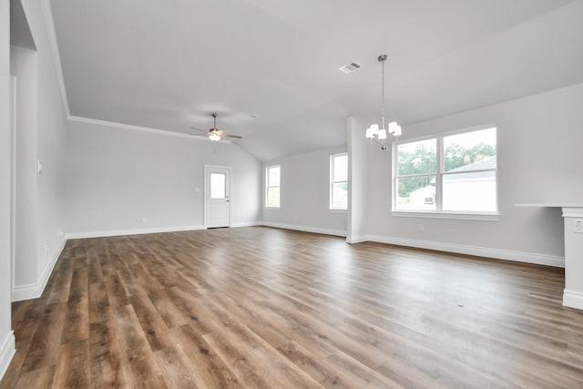 unfurnished living room featuring ceiling fan with notable chandelier, dark hardwood / wood-style flooring, lofted ceiling, and crown molding