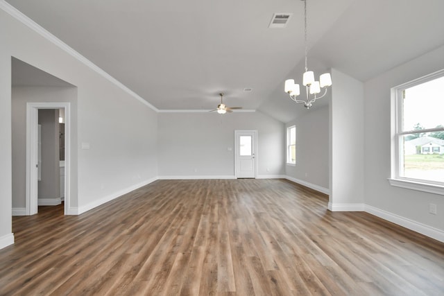 unfurnished living room with ceiling fan with notable chandelier, hardwood / wood-style flooring, plenty of natural light, and lofted ceiling