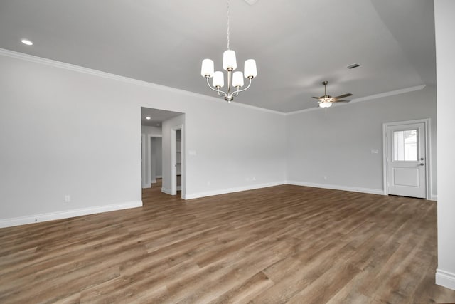 interior space featuring ceiling fan with notable chandelier, wood-type flooring, and ornamental molding