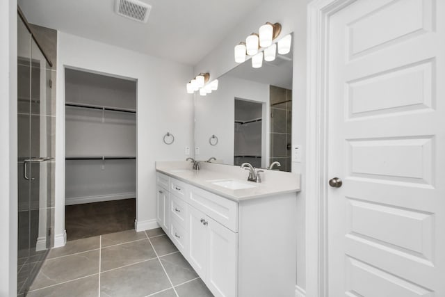 bathroom with tile patterned flooring and vanity