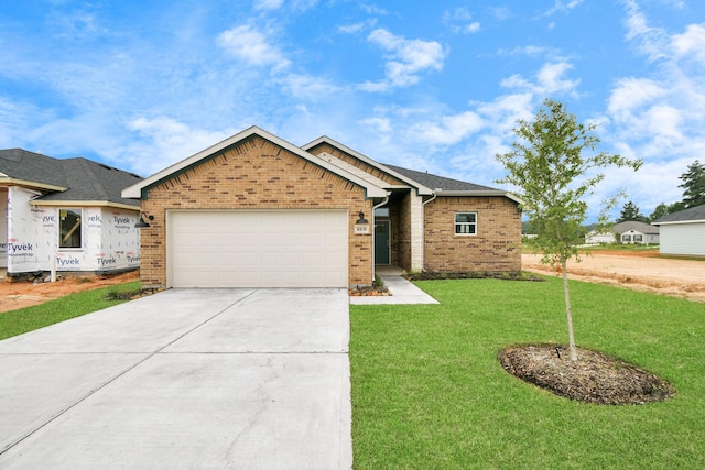 view of front of house with a front lawn and a garage