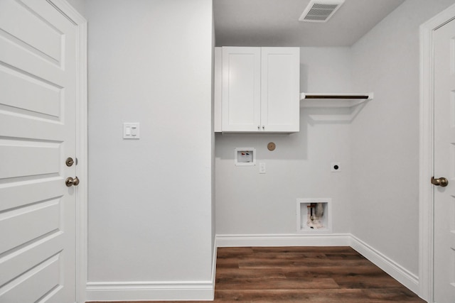 clothes washing area with cabinets, washer hookup, dark hardwood / wood-style flooring, and electric dryer hookup