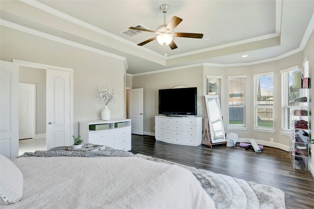 bedroom with dark hardwood / wood-style flooring, a raised ceiling, ceiling fan, and crown molding