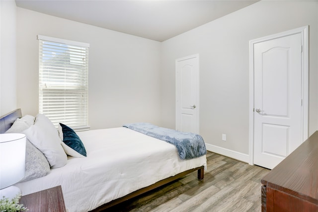 bedroom with light hardwood / wood-style flooring