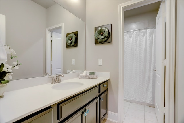 bathroom with tile patterned flooring and vanity