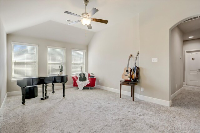 living area with light colored carpet, ceiling fan, and lofted ceiling