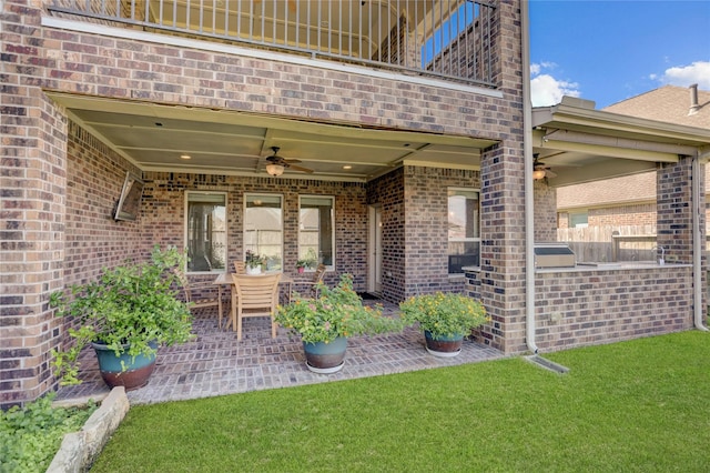 view of patio / terrace featuring ceiling fan