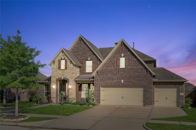 view of front of property with a garage