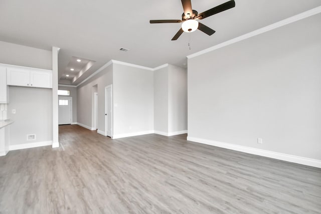 unfurnished living room featuring crown molding, light hardwood / wood-style flooring, and ceiling fan