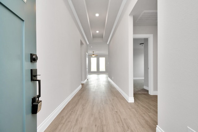 corridor with light hardwood / wood-style floors