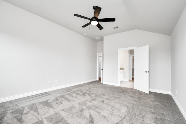 unfurnished bedroom with ceiling fan, lofted ceiling, and light carpet