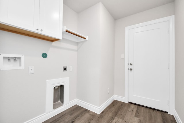 clothes washing area with hookup for an electric dryer, cabinets, dark wood-type flooring, and hookup for a washing machine