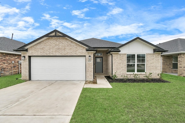 view of front of home with a garage and a front lawn