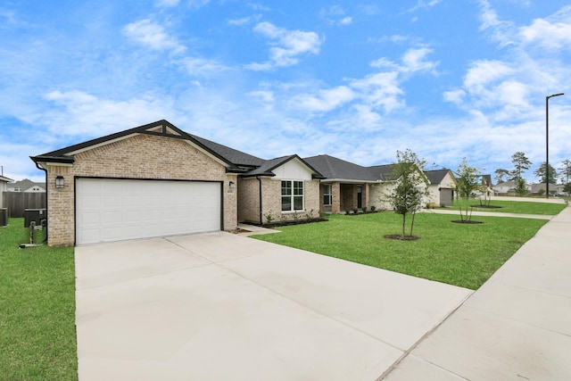 single story home featuring a garage and a front lawn