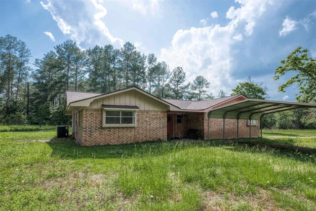 exterior space featuring central AC and a carport