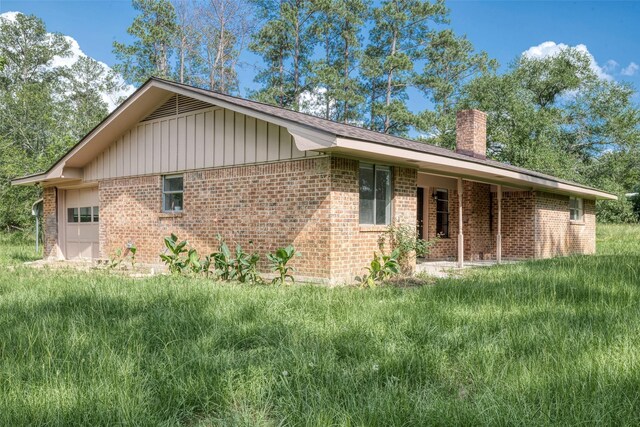 exterior space with a front lawn and a garage