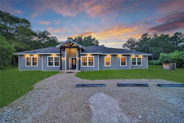 ranch-style home with a front lawn