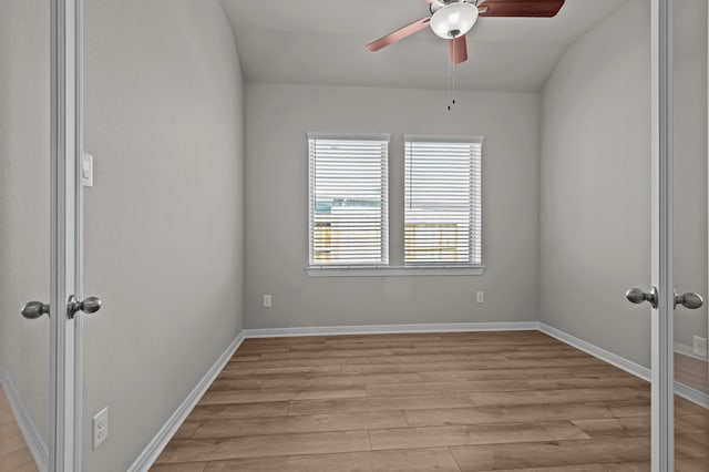 unfurnished room featuring vaulted ceiling, light hardwood / wood-style flooring, and ceiling fan