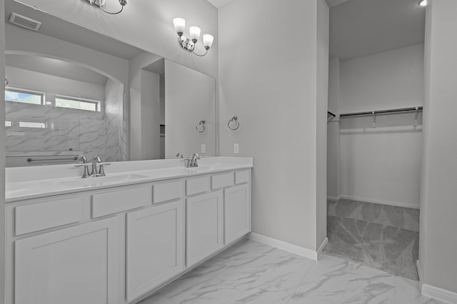 bathroom with walk in shower and vanity