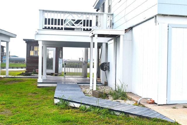 rear view of house featuring a yard