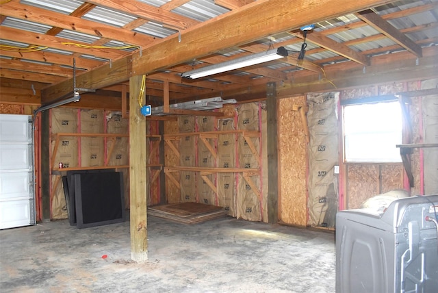 interior space featuring washer / clothes dryer and concrete flooring