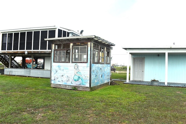 view of outbuilding featuring a yard