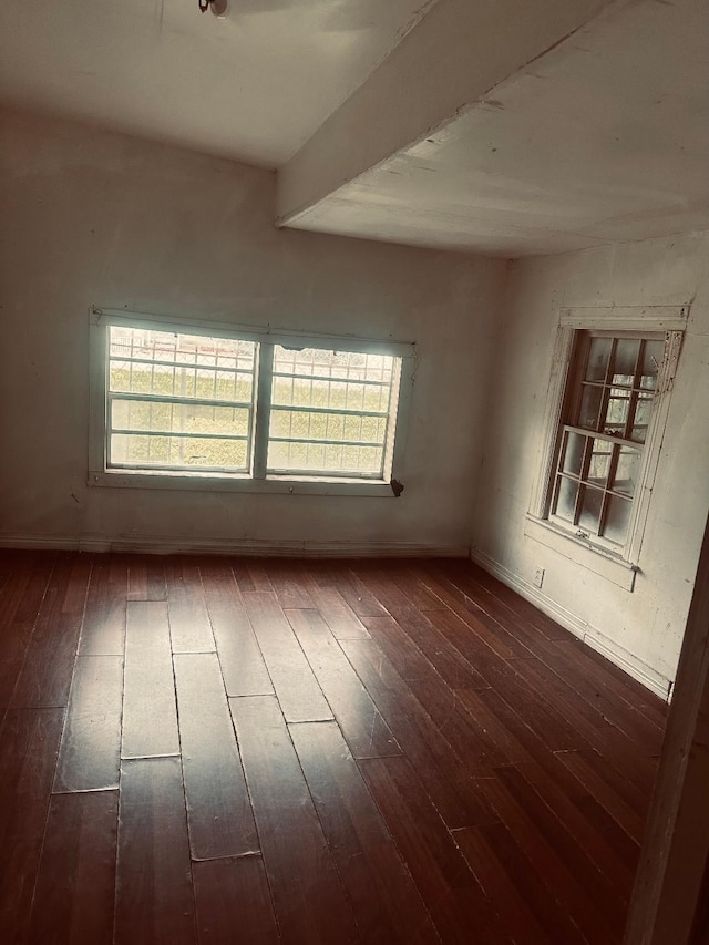 empty room featuring dark wood-type flooring