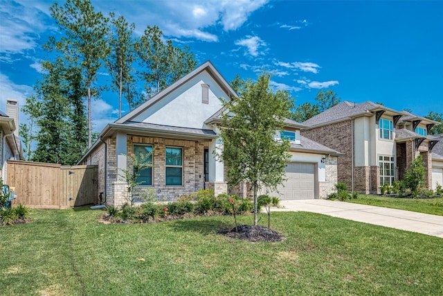 view of front of house featuring a garage and a front yard