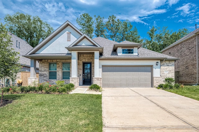 view of front of property featuring a front yard and a garage