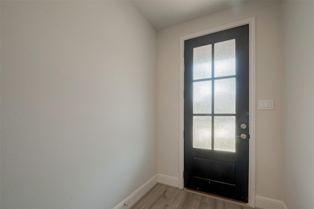 doorway with light hardwood / wood-style floors