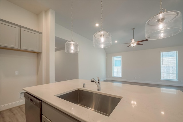 kitchen with dishwasher, gray cabinets, light hardwood / wood-style flooring, and sink