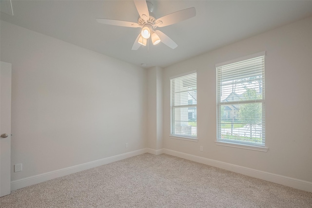 carpeted empty room with ceiling fan