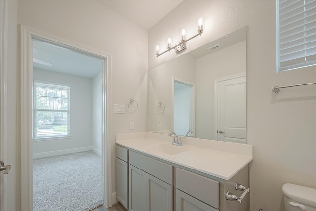 bathroom with vanity and toilet