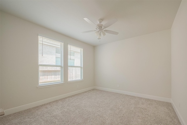 empty room featuring ceiling fan and carpet floors