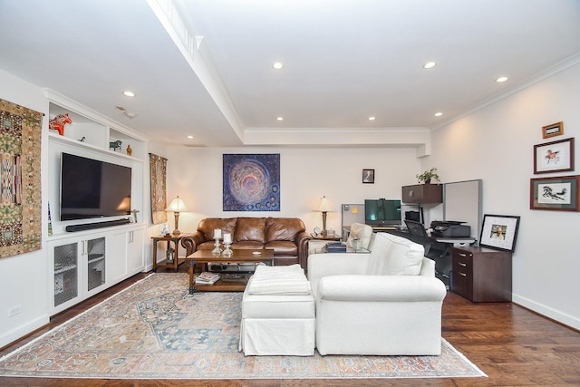 living room featuring hardwood / wood-style flooring and crown molding