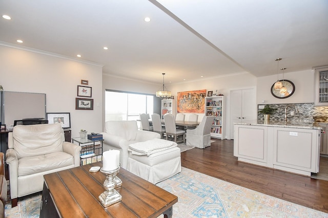 living room with ornamental molding and dark wood-type flooring