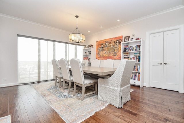 dining space with a chandelier, dark hardwood / wood-style flooring, and ornamental molding