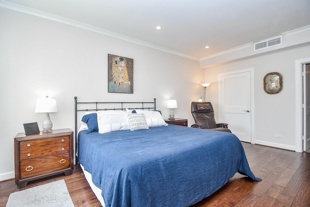 bedroom with crown molding and dark wood-type flooring