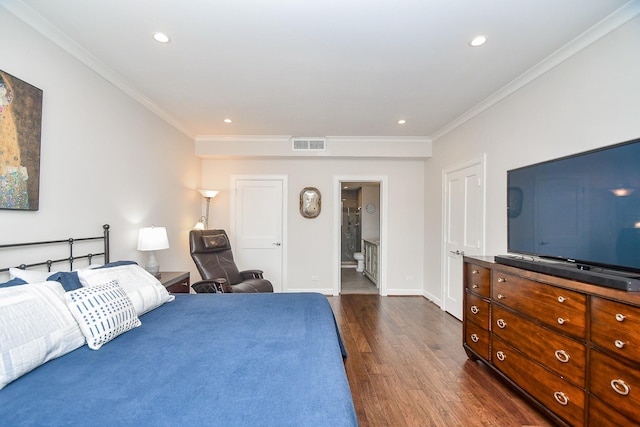 bedroom featuring ensuite bathroom, crown molding, and dark wood-type flooring