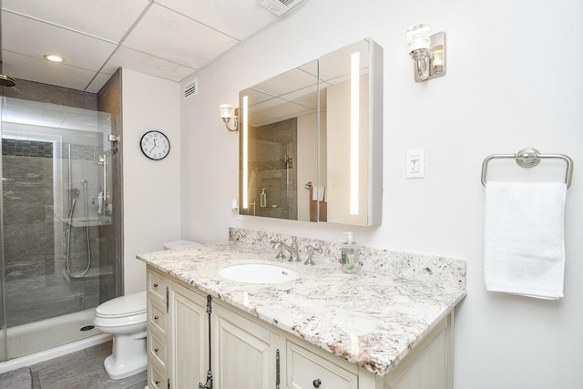 bathroom with walk in shower, tile patterned floors, vanity, and toilet