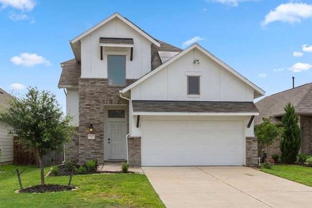 view of front of house with a front yard and a garage