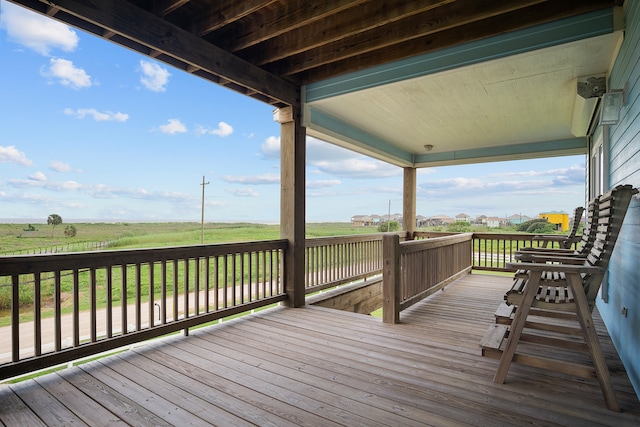 wooden terrace with a rural view