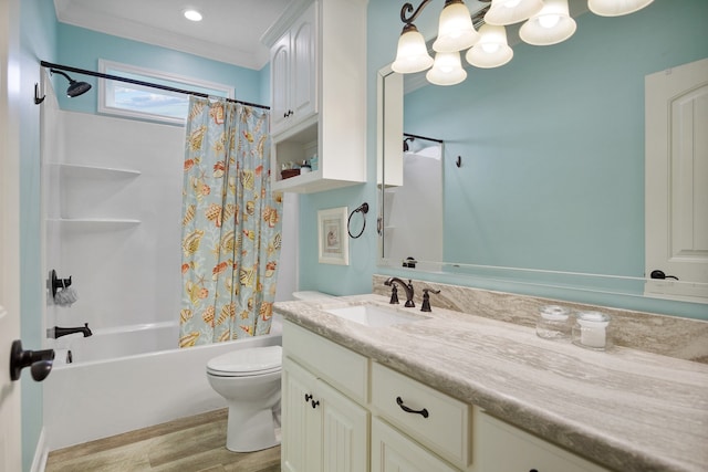 full bathroom with ornamental molding, shower / bath combo, hardwood / wood-style floors, vanity with extensive cabinet space, and toilet