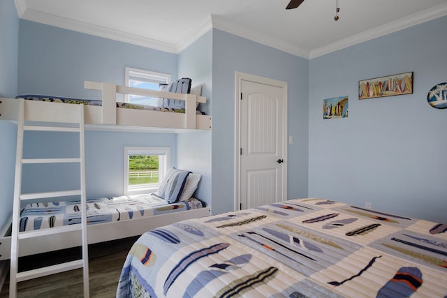 bedroom featuring wood-type flooring, a closet, ceiling fan, and ornamental molding