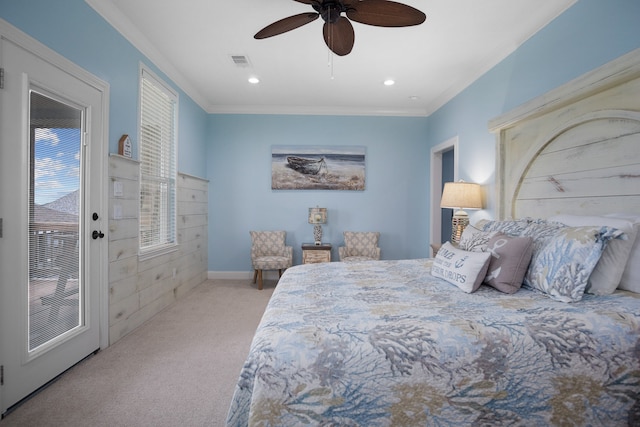 carpeted bedroom featuring ornamental molding and ceiling fan