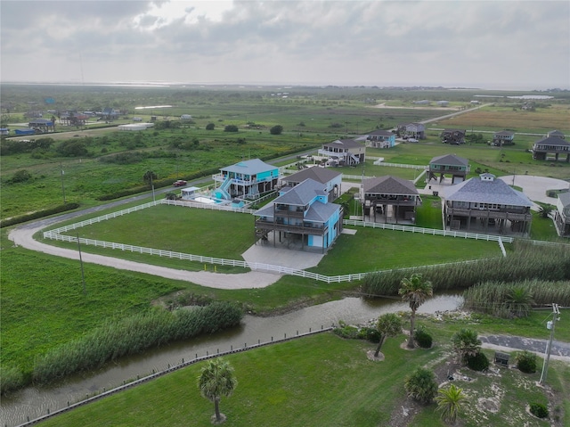 birds eye view of property with a rural view