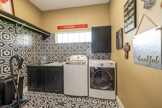 washroom featuring sink, tile patterned floors, separate washer and dryer, and cabinets