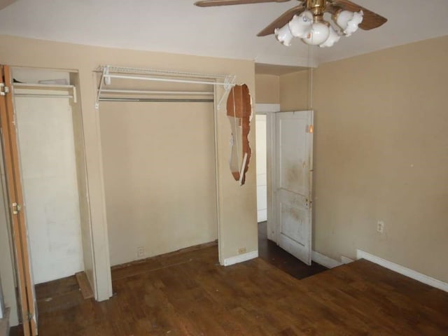 unfurnished bedroom featuring ceiling fan and dark hardwood / wood-style flooring